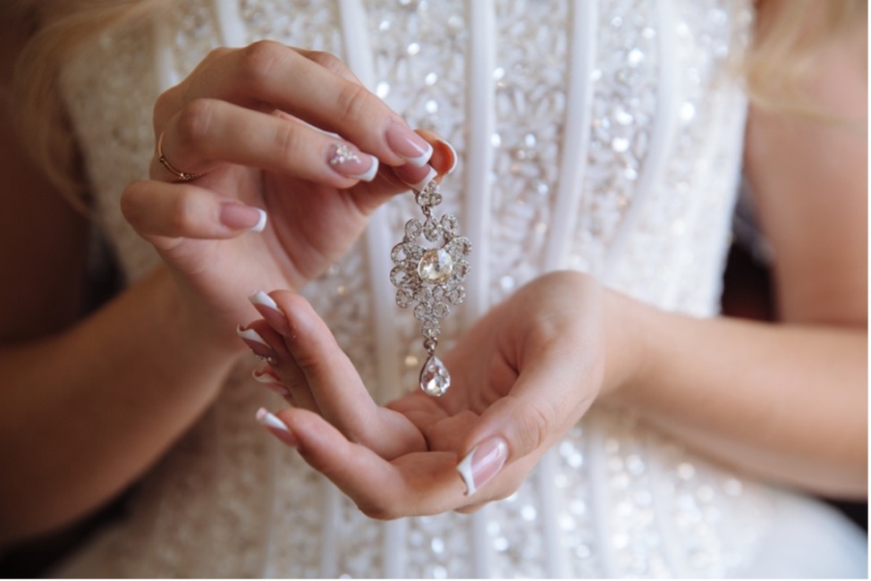 A bride is showing her matching accessories.